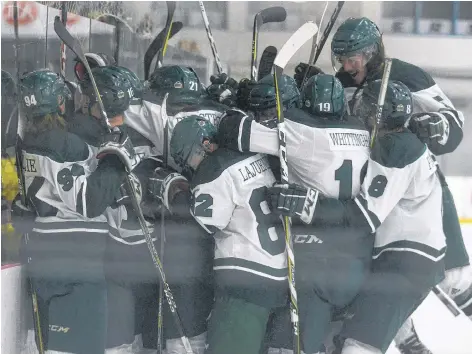  ?? JASON MALLOY/THE GUARDIAN ?? The UPEI Panthers celebrate Brent Andrews overtime goal Thursday in Game 1 of the Atlantic University Sport quarter-final with the Universite de Moncton at MacLauchla­n Arena.