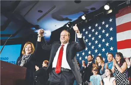  ?? AAron Ontiveroz, The Denver Post ?? Colorado Gov.-elect Jared Polis walks onto the stage at the Democratic watch party in downtown Denver on Tuesday with running mate Dianne Primavera after defeating Republican Walker Stapleton.