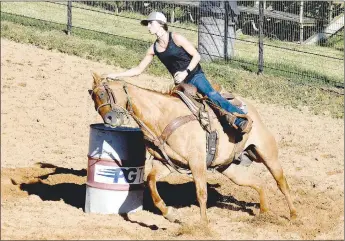  ?? PHOTOS BY MARK HUMPHREY ENTERPRISE-LEADER ?? Dusti Cole was among those competing in barrel racing during Lincoln Riding Club’s Sunday Play Day. Rodeo fans can see this and more during the Lincoln Rodeo Aug. 6-8, which recently received approval from the Arkansas Department of Health to conduct its 67th annual rodeo.