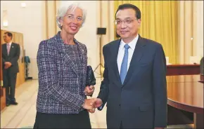  ?? LIU ZHEN / CHINA NEWS SERVICE ?? Premier Li Keqiang meets with Christine Lagarde, managing director of the Internatio­nal Monetary Fund, in the Great Hall of the People in Beijing on Sunday.