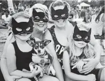  ??  ?? Visitors deck themselves out in cat attire for the 2016 Cat Video Festival. This year’s festival will be Saturday at the Myriad Gardens.