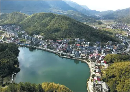  ?? HUANG ZONGZHI / XINHUA ?? Above: A bird’s-eye view of Anji county, Huzhou city, Zhejiang province, where President Xi Jinping proposed a new developmen­t method.