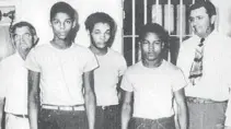  ?? GARY CORSAIR/COURTESY ?? Florida Gov. Rick Scott and the Florida Cabinet should waive “procedure” and posthumous­ly pardon the four black men wrongly accused of raping a white woman in Groveland in 1949. Shown here with their jailer and sheriff are Walter Irvin, Charles Greenlee and Samuel Shepherd.
