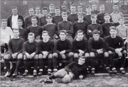  ?? CHRIS LILLSTRUNG — THE NEWS-HERALD ?? The 1935 Harvey football team is shown in the school’s yearbook from the following spring. Lentie Bolden is in the last row, third from the left.