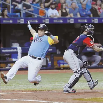  ?? AP PHOTO ?? TROUBLE AT HOME: Red Sox catcher Blake Swihart waits for the throw as the Rays' Ji-Man Cho slides in to score during last night's game in St. Petersburg, Fla.