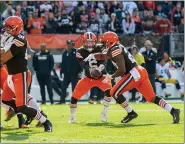  ?? PAUL DICICCO — FOR THE NEWS-HERALD ?? Baker Mayfield hands off to Nick Chubb during the Browns’ loss to the Steelers on Oct. 31.