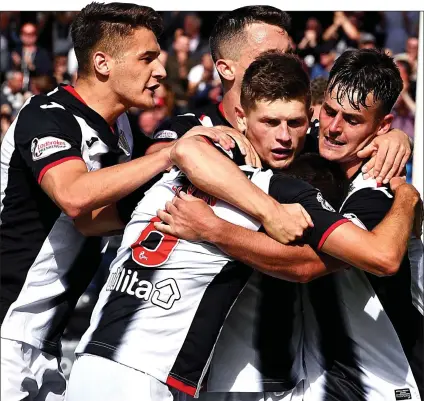  ??  ?? WELL DONE BUDDIE: Danny Mullen (far right) is joined by team-mates to celebrate the St Mirren striker’s late winner