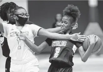  ?? Photos by Elizabeth Conley / Staff photograph­er ?? Sterling’s Destiny Lewis (2) is one of the freshman on the Raiders’ young roster who sees playing time. Sterling has made the playoffs each of the past two seasons but is seeking a win.