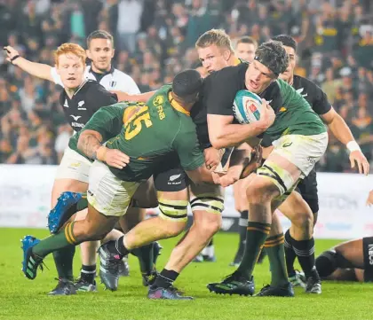  ?? Photo / Getty ?? Scott Barrett carries the ball strongly for the All Blacks against the Springboks at Ellis Park.