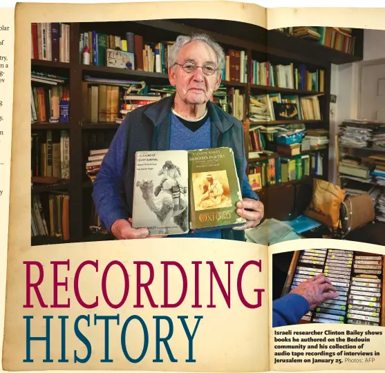  ?? Photos: AFP ?? Israeli researcher Clinton Bailey shows books he authored on the Bedouin community and his collection of audio tape recordings of interviews in Jerusalem on January 25.