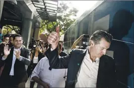  ?? Jay L. Clendenin Los Angeles Times ?? GAVIN NEWSOM leaves a campaign stop at Grand Central Market in downtown L.A. “You sleep with one eye open this late in the campaign,” Newsom said.