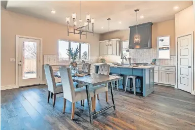  ??  ?? Dining area and kitchen at 2401 Amante Court, Edmond, by Ripple Creek Homes LLC, for the Parade of Homes Spring Festival. [PHOTOS PROVIDED BY CENTRAL OKLAHOMA HOME BUILDERS ASSOCIATIO­N]