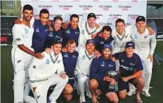  ?? AP ?? ■ The New Zealand team pose with their trophy after winning the Test series against England in Christchur­ch yesterday.