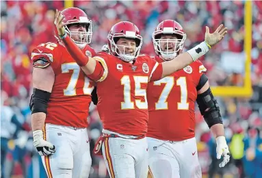  ?? ED ZURGA THE ASSOCIATED PRESS ?? Chiefs’ Patrick Mahomes (15) celebrates a touchdown pass with Eric Fisher and Mitchell Schwartz (71) in the second half of the AFC Championsh­ip Game against the Tennessee Titans on Sunday in Kansas City. The Chiefs won, 35-24.
For the result of the NFC Championsh­ip Game between Green Bay and San Francisco, visit therecord.com.