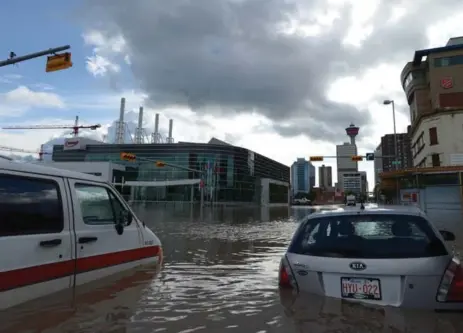  ?? JONATHAN HAYWARD/THE CANADIAN PRESS ?? Some programs, such as Shoppers Drug Mart’s Optimum program, let you donate to disaster relief efforts, such as the 2013 floods in Calgary.