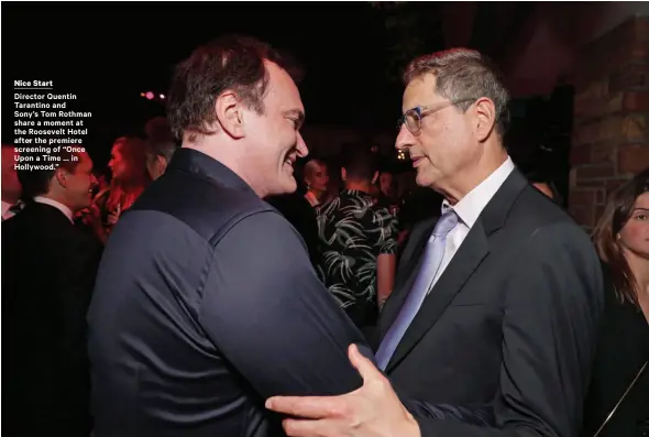  ??  ?? Director Quentin Tarantino and Sony’s Tom Rothman share a moment at the Roosevelt Hotel after the premiere screening of “Once Upon a Time … in Hollywood.”