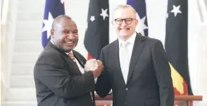  ?? AFP photo — ?? Marape shaking hands with Albanese at Parliament House in Canberra.