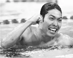  ??  ?? Hagino celebrates after winning the men’s 400m individual medley final during the swimming event at the Rio Olympic Games at the Olympic Aquatics Stadium in Rio de Janeiro in this August 7, 2016 file photo.