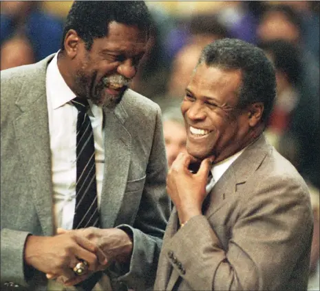  ?? Mike Kullen / Associated Press ?? Sacramento Kings coach Bill Russell, left, and Celtics coach K.C. Jones, former Celtics teammates, meet before a 1988 game.