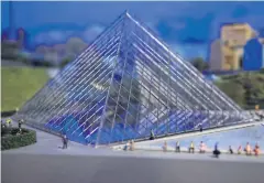  ??  ?? A miniature model of the Louvre in Paris.