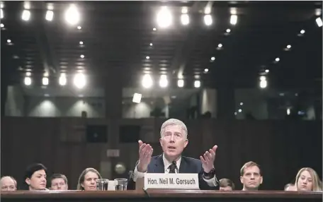  ?? Justin Sullivan Getty Images ?? JUDGE NEIL GORSUCH took the high court ruling in stride. “That’s fine. I will follow the law,” he told the Senate Judiciary Committee.