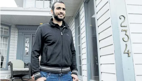  ?? THE CANADIAN PRESS FILES ?? Omar Khadr walks out the front door of his lawyer Dennis Edney’s home to speak the media in Edmonton, Ata., on May 7, 2015. The lawyer for the widow of an American soldier killed in Afghanista­n said Tuesday they have filed an applicatio­n so that any...