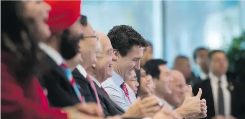  ?? SEAN KILPATRICK / THE CANADIAN PRESS ?? Canadian Prime Minister Justin Trudeau is all smiles as he is introduced during an event at Sina Weibo Headquarte­rs in Beijing this week on a trip to promote Canada- China economic ties.