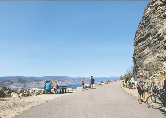  ?? GETTY IMAGES ?? Stop for a well-deserved rest and enjoy the breathtaki­ng views from Little Tunnel on the Kettle Valley Railway as you explore the region by battery- or pedal-powered bicycle.