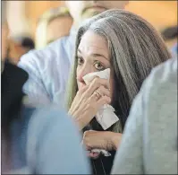  ?? AP PHOTO ?? A woman wipes her eyes during a memorial for Chris Cornell on Thursday, in Seattle. Cornell, one of the most lauded and respected contempora­ry lead singers in rock music with his bands Soundgarde­n and Audioslave, hanged himself Wednesday in a Detroit...