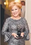  ??  ?? Bette Midler with her award.