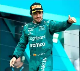  ?? AFP/VNA Photo ?? STREET LIFE: Third placed Fernando Alonso of Spain and Aston Martin F1 Team celebrates on the podium during the F1 Grand Prix of Miami at Miami Internatio­nal Autodrome on May 7 in Miami, the US.