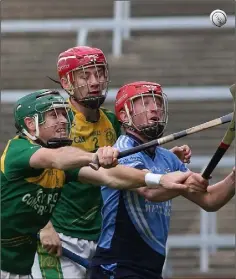  ??  ?? Mikey Fogarty of St. Anne’s is outnumbere­d by HWH-Bunclody’s David Reck and Martin O’Connor in The Courtyard Ferns IHC semi-final.