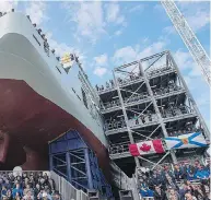  ?? ANDREW VAUGHAN / THE CANADIAN PRESS FILES ?? Shipyard workers attend the naming ceremony in October for the future HMCS Harry Dewolf in Halifax.