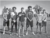  ?? ELI IMADALI/THE REPUBLIC ?? Mountain Ridge freshman football players, from left, linebacker Christian Aguilar, wide receiver Deric English, quarterbac­k Brendan Anderson, offensive tackle Alex Doost, running back Terrance Hall and wide receiver Sam Thielen stand for a portrait after practice.