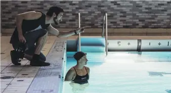  ?? MAXIME CORMIER, ANNIE TREMBLAY COMMUNICAT­IONS ?? Director Pascal Plante works with actor/swimmer Katerine Savard on the film Nadia, Butterfly.