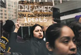  ?? Spencer Platt / Getty Images ?? Demonstrat­ors in New York protest the lack of a deal on the DACA program, which was one of the issues at the heart of the shutdown.