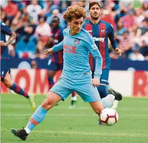  ?? AFP PIC ?? Atletico Madrid’s Antoine Griezmann controls the ball in a La Liga match against Levante at the Ciutat de Valencia Stadium on Saturday.