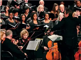  ?? Staff file photo by Hunt Mercier ?? ■ Members of the Texarkana Regional Orchestra play and the choir sings "Joshua Fit the Battle of Jericho" while being directed by Marc-André Bougie at the 2019 SoulFest. SoulFest is part of the local Black History Month celebratio­n each February. This year’s event takes place at 4 p.m. on Sunday, Feb. 9, in the Great Room of the Truman Arnold Student Center at Texarkana College.