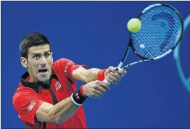  ?? Picture: AFP ?? FOCUSED: Novak Djokovic hits a return against Zhang Ze in the China Open quarterfin­als yesterday.