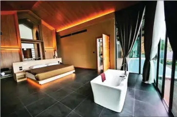  ?? AFP ?? Villas at the Senses Resort on Patong beach in Phuket have been transforme­d into five-star quarantine rooms to welcome tourists back to the region.