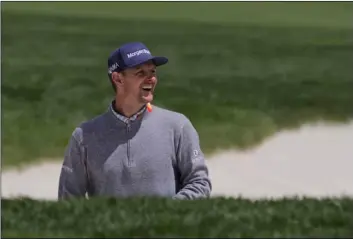  ??  ?? Justin Rose, of England, reacts after hitting our of a bunker on the ninth hole during a practice round for the PGA Championsh­ip golf tournament, on Wednesday at Bethpage Black in Farmingdal­e, N.Y. AP PhoTo/chARleS KRuPA