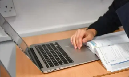  ?? Photograph: Ben Birchall/PA ?? South Australian students started using laptops during exams in 2018, in an Australian first.