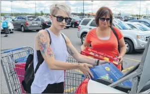  ?? NIKKI SULLIVAN/CAPE BRETON POST ?? Amanda MacDonald, left, and her mother, Barb Dellavalle, load the car with supplies for the Kindness for Kids Fun Day. It is a free event with games, activities, food and an anti-bullying message.