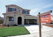  ?? [AP PHOTO] ?? A for sale sign hangs outside a recently built house Friday near Roseville, Calif.