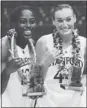  ?? MARCO GARCIA/ AP ?? Chiney Ogwumike, left, and Joslyn Tinkle pose after Stanford’s victory.