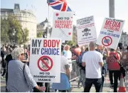  ?? REUTERS ?? People gather in Trafalgar Square to protest against the disease control measures imposed by the government, following the resurgence of the coronaviru­s disease, in London on Saturday.