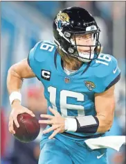  ?? USA Today Sports - Nathan Ray Seebeck ?? After leading the Jaguars on an improbable run to the AFC South title, quarterbac­k Trevor Lawrence will be in the spotlight for Saturday’s playoff game against the Chargers.