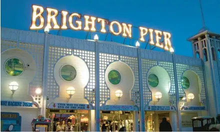  ?? LAUREN MILLS/RICK STEVES’ EUROPE ?? Brighton’s Palace Pier is glittering and shiny with amusement park rides and carnival games.