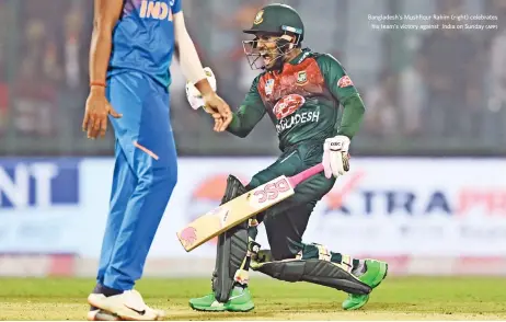  ?? (AFP) ?? Bangladesh's Mushfiqur Rahim (right) celebrates his team’s victory against India on Sunday