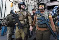  ?? (AP/Julio Cortez) ?? Demonstrat­ors stand outside a security zone Monday before a progun rally in Richmond, Va. Video at arkansason­line.com/121rally